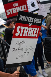 Apple-rotten-to-the-core-picket-sign.jpg