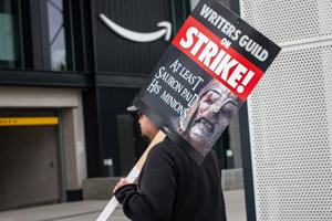 Picket-holds-Lord-of-the-Rings-inspired-sign-outside-Amazon.jpg