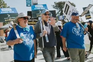 WGA-Negotiating-Committee-Co-Chair-Christopher-Keyser-and-WGA-members-on-the-picket-lines-in-support-of-SAG-AFTRA-at-Fox-on-October-2.-Photo-J.W.-Hendricks.jpg