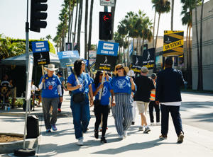 WGA-Negotiating-Committee-and-WGAW-Board-member-Ashley-Gable-(far-left)-_-WGA-members-walk-the-line-in-solidarity-with-SAG-AFTRA-at-Paramount-Pictures-on-October-2.jpg