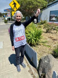 Member-April-Dammann-shows-her-support-in-downtown-Gualala-CA-population-2500-where-she-moved-from-Hollywood-six-years-ago..jpg