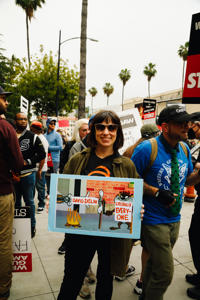 Animation-Guild-members-bring-the-fire-to-the-TAG-solidarity-event-at-Warner-Bros.-Photo.-Brittany-Woodside.jpg