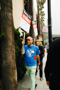 WGA-Negotiating-Committee-members-Raphael-Bob-Waksberg-and-Adam-Conover-on-the-picket-line-at-The-Animation-Guild-solidarity-event-at-Warner-Bros.-Photo.-Brittany-Woodside.jpg