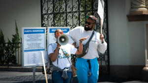 On-the-bullhorn-at-the-Juneteenth-picket.-Photo-by-Antonio-Reinaldo.jpg