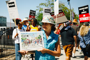 Artist-Lois-Keller-and-one-of-her-live-picket-line-paintings-at-TV-City.-Photo-Brittany-Woodside.jpg