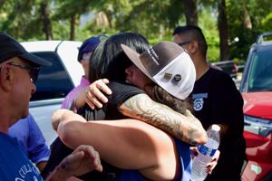 Lindsay-Dougherty-and-Liz-Hsiao-Lan-Alper-embrace-at-the-Teamsters-rally-for-Good-Jobs-and-Safe-Streets-in-Arcadia-on-9-18.jpeg