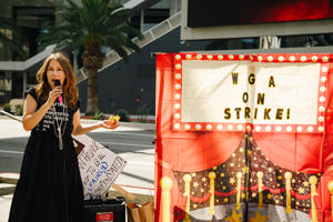 Lot-Coordinator-and-Red-Carpet-Picket-organizer-Melissa-Blake-announces-raffle-prize-winners-at-Universal-9-18-Photo-Brittany-Woodside.jpg