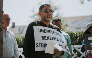 SEIU-United-Service-Workers-West-Member-Mario-Marrufo-at-the-Unemployment-Insurance-We-Earned-It-picket-at-Amazon.-Photo-J.W.-Hendricks.jpg